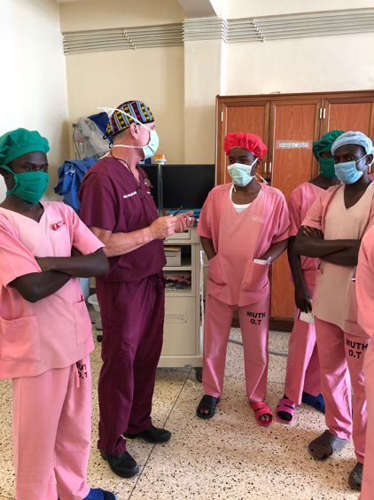 Dr-Hisey-teaching-some-of-the-residents-and-medical-students-Uganda-Spine-Surgery-Mission-2019-Day14