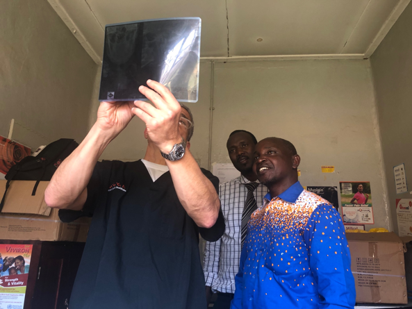 Dr-Lieberman-and-patient-looking-at-xray-Uganda-Spine-Surgery-Mission-2019-day11
