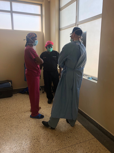 Drs-Kayanja-Schaffer-and-Kisitu-discussing-next-steps-Uganda-Spine-Surgery-Mission-2019-Day7