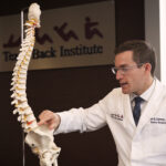 Dr Derman demonstrating nerve compression