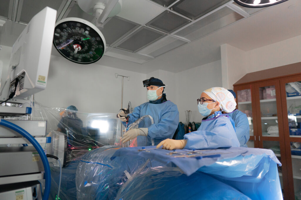 Dr. Derman in an operating room conducting endoscopic spine surgery