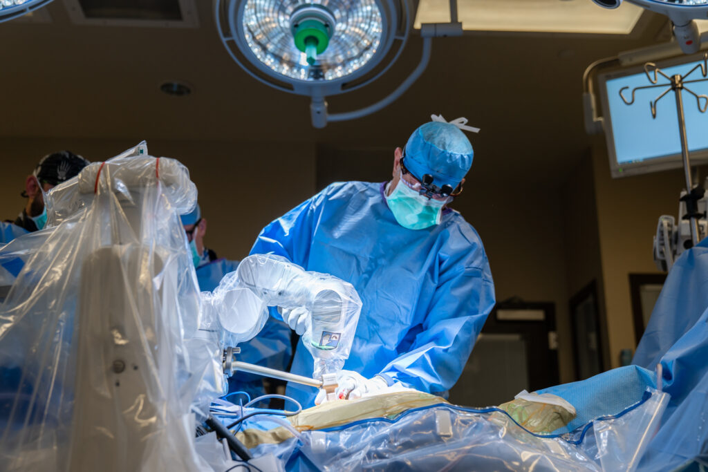 Doctor performing robotics in spinal surgery