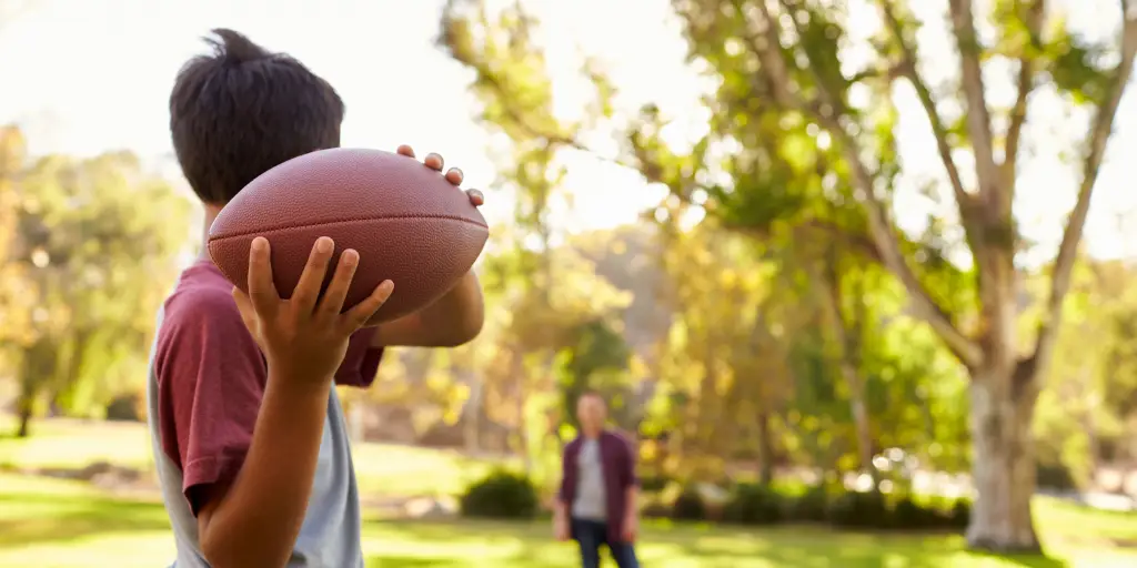 Child throwing football 