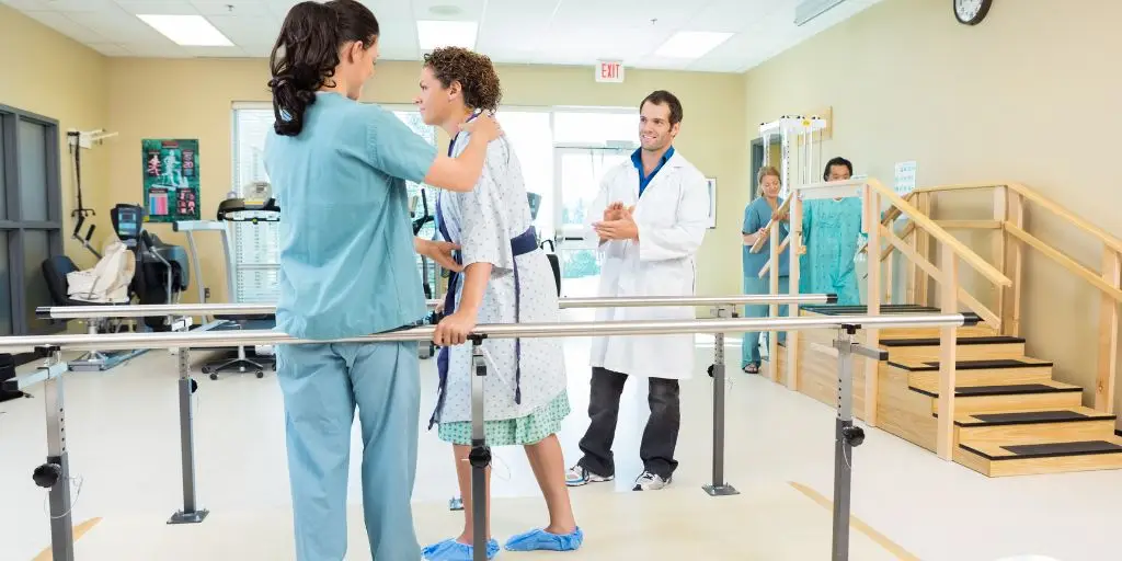 Female going through physical therapy with doctor