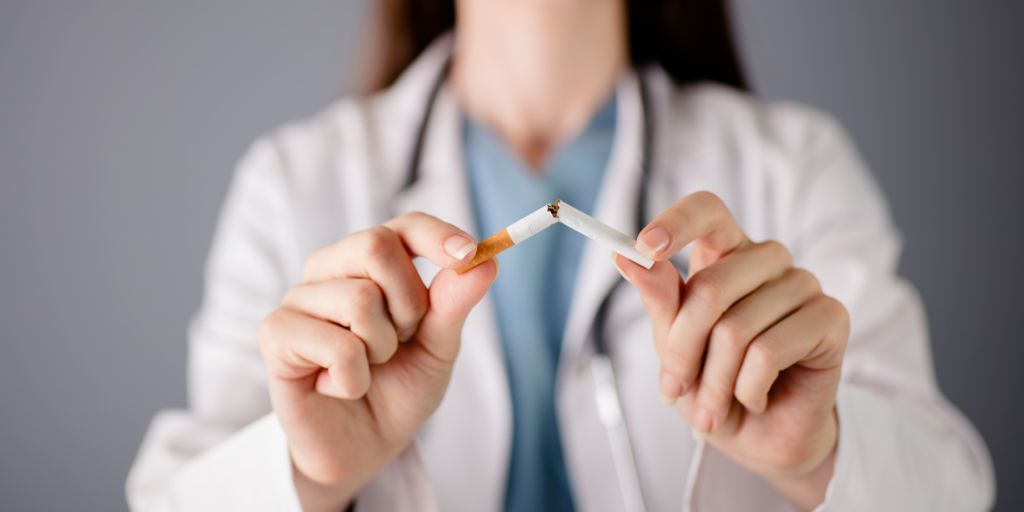 Doctor breaking a cigarette in half