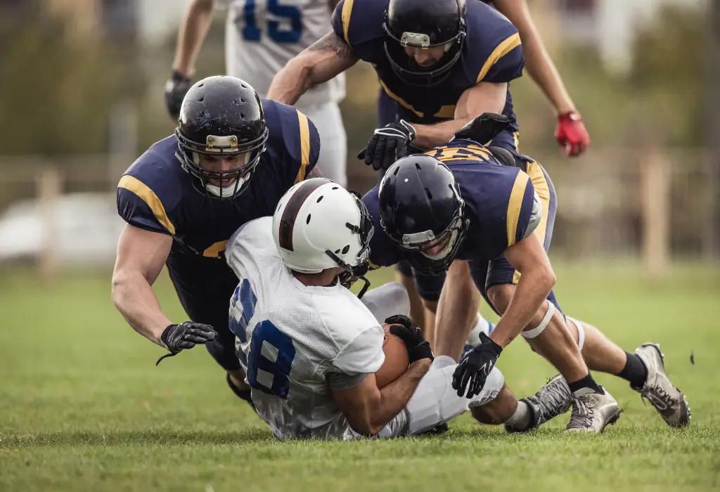 Texas Back Institute Chronic Traumatic Encephalopathy Football Player Being Tackled